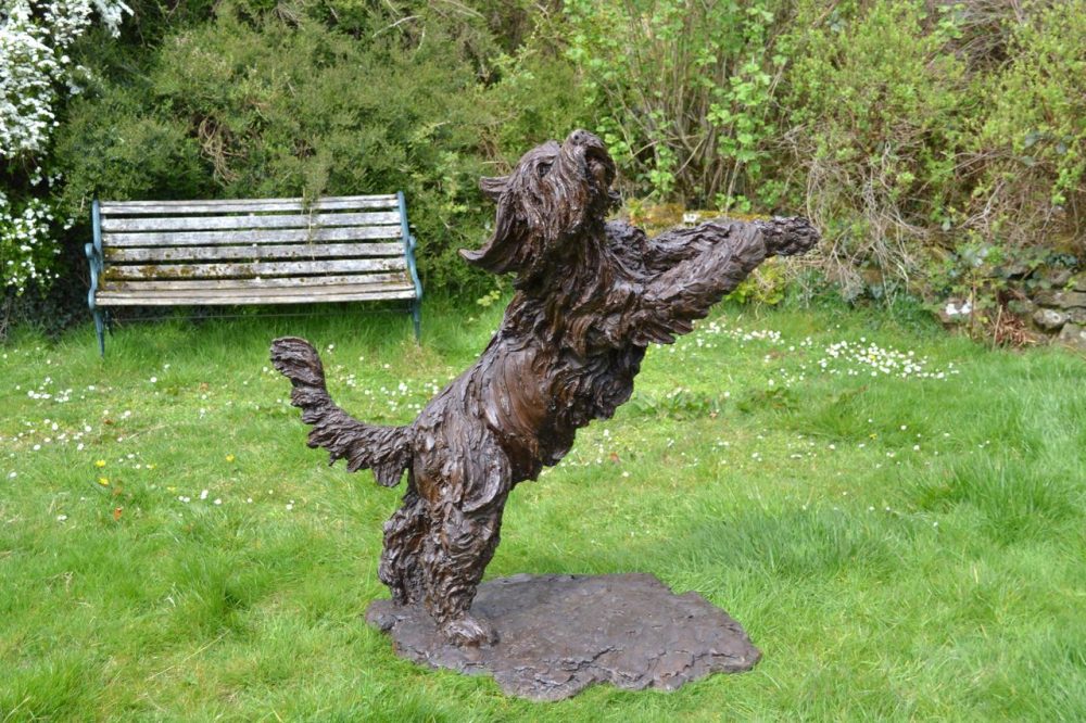 leaping bearded collie sculpture