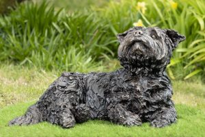 Lying yorkshire terrier sculpture