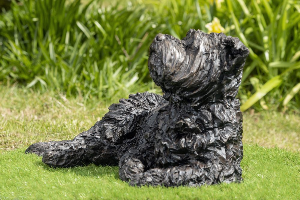 lying yorkshire terrier statue