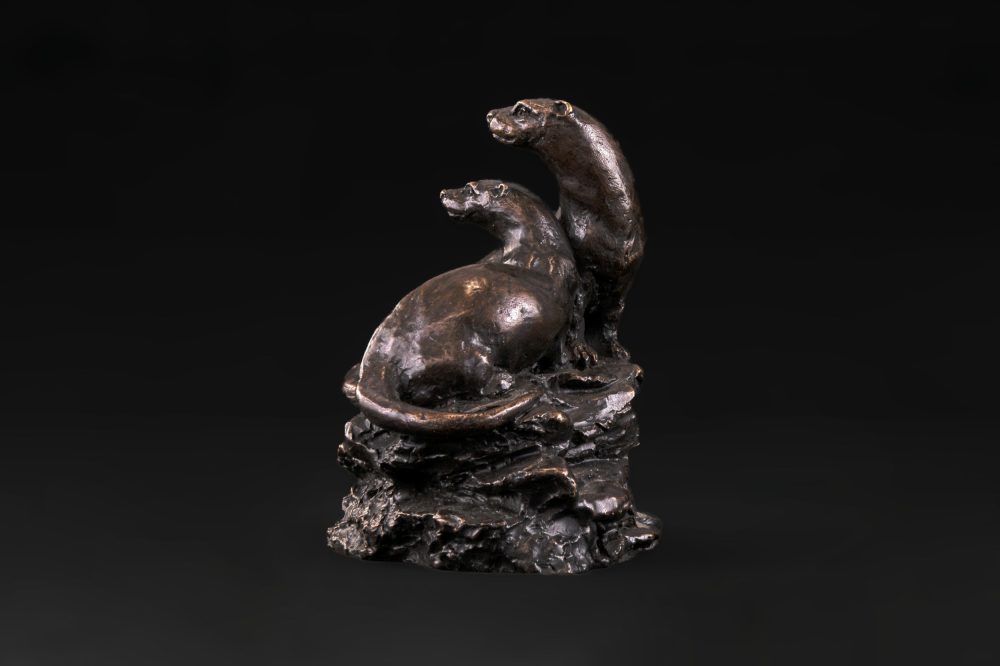 Bronze otter sculpture