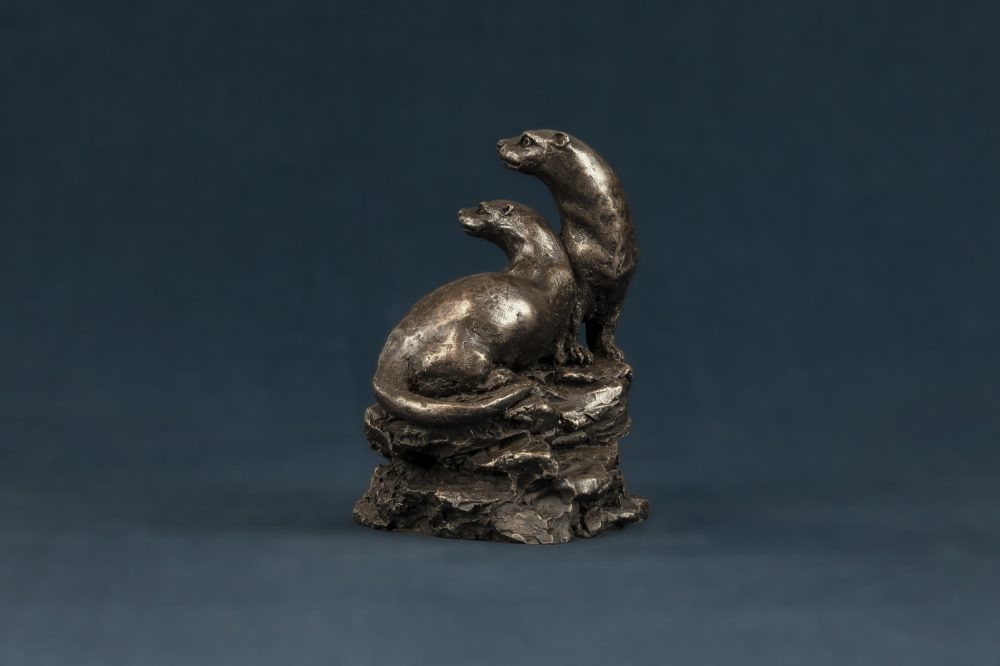 bronze pair of otters ornament