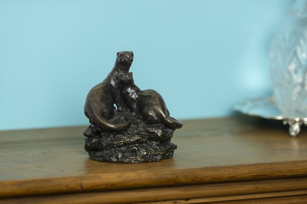 otter ornament on mantelpiece