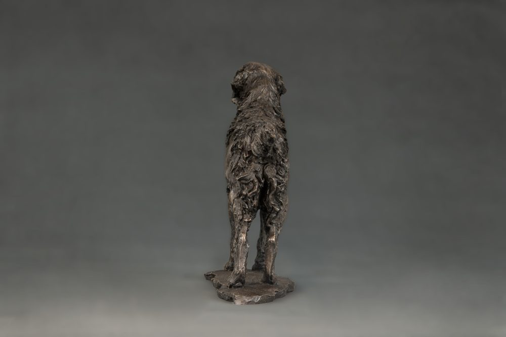 bronze dog statue of golden retriever