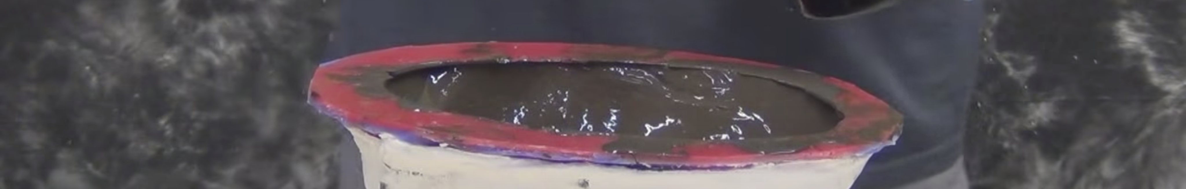 Close up of bronze resin being made