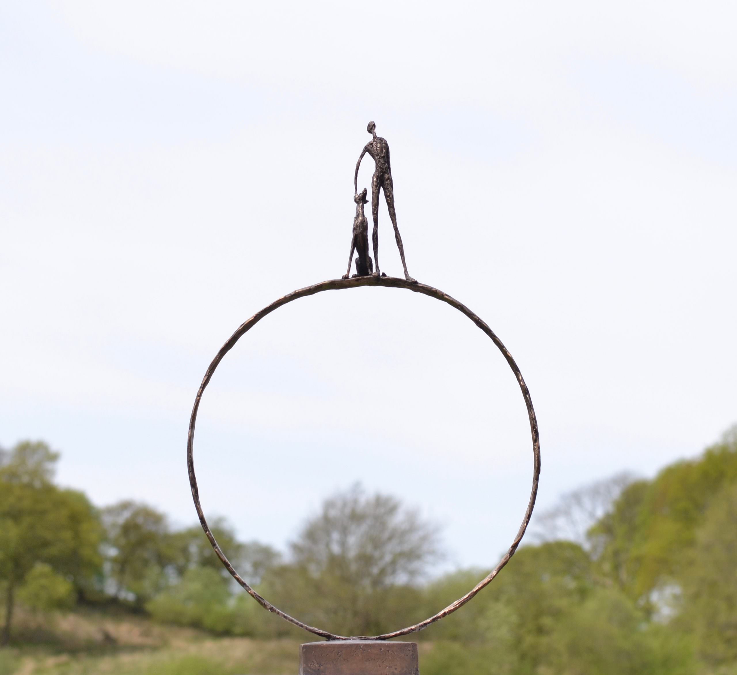 'Stargazers' man and dog on ring sculpture