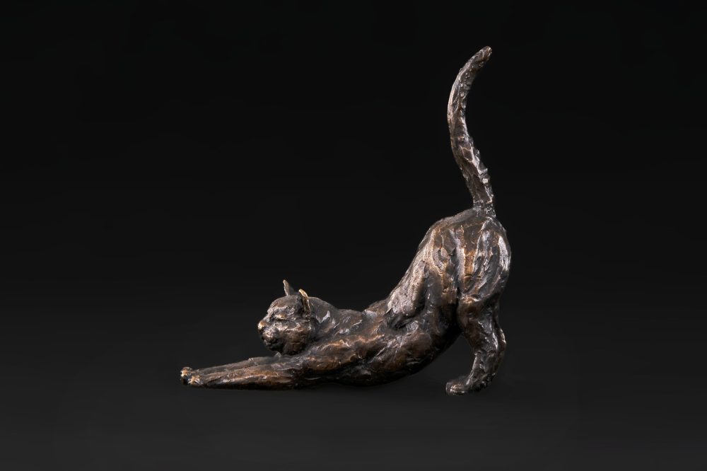 stretching cat side statue
