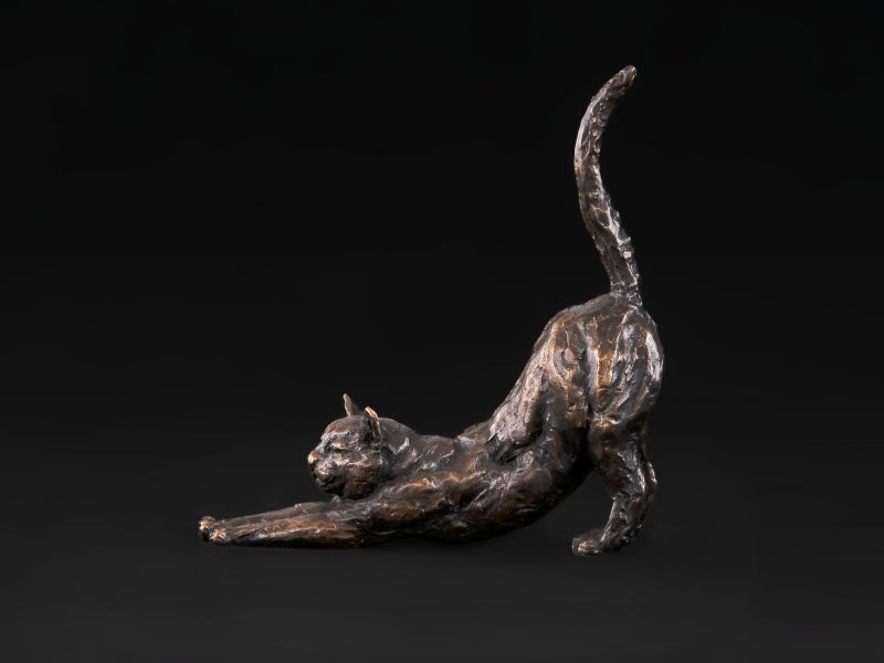 stretching cat side statue