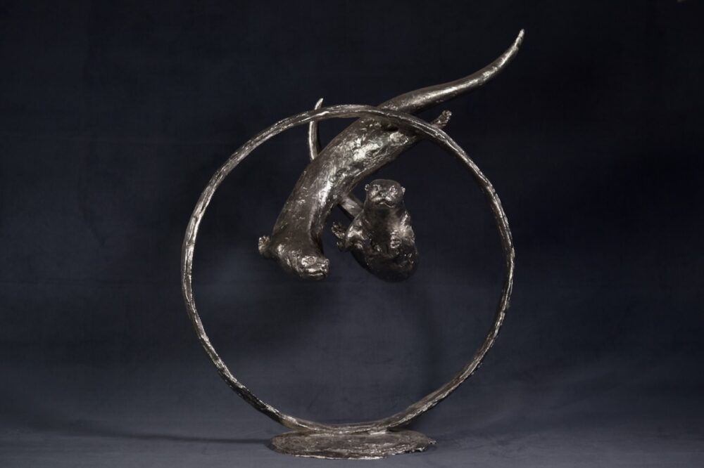 Swimming Otters Statue, Stainless steel otter sculpture, Through Clear Water Statue. Tanya Russell