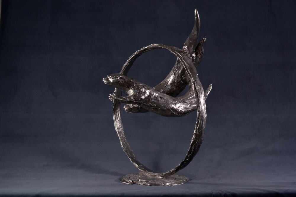 Swimming Otters Statue, Stainless steel otter sculpture, Through Clear Water Statue. Tanya Russell