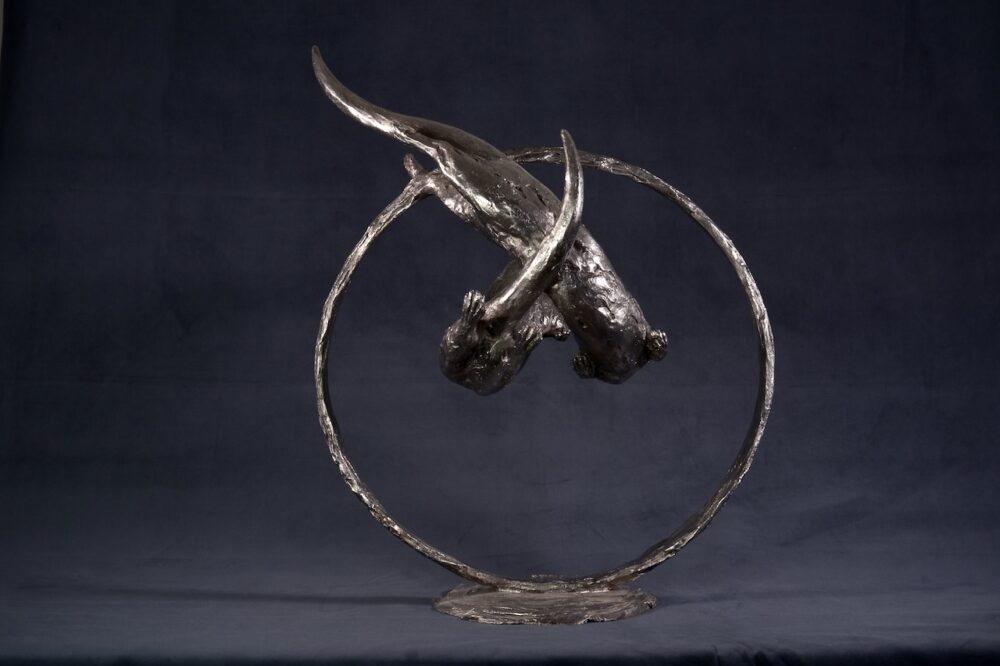 Swimming Otters Statue, Stainless steel otter sculpture, Through Clear Water Statue. Tanya Russell