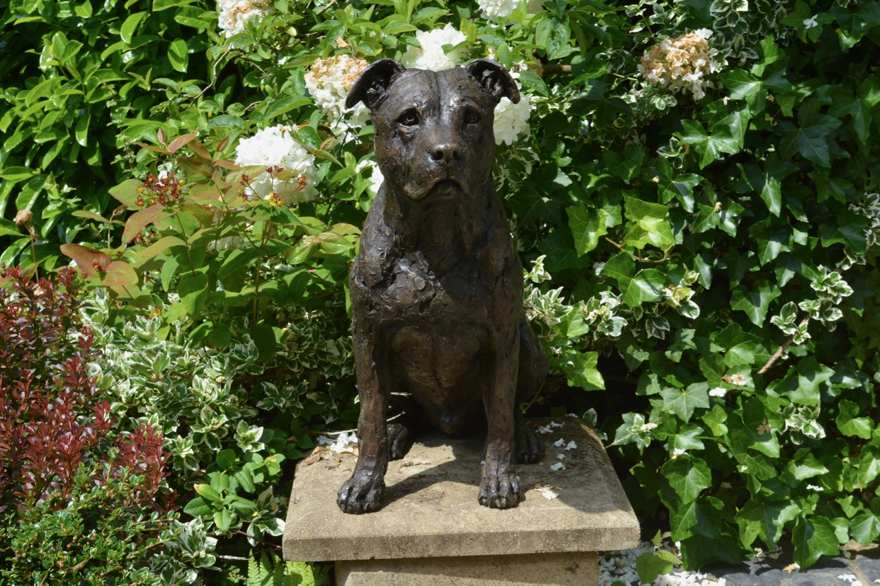 sitting bronze terrier outdoor statue