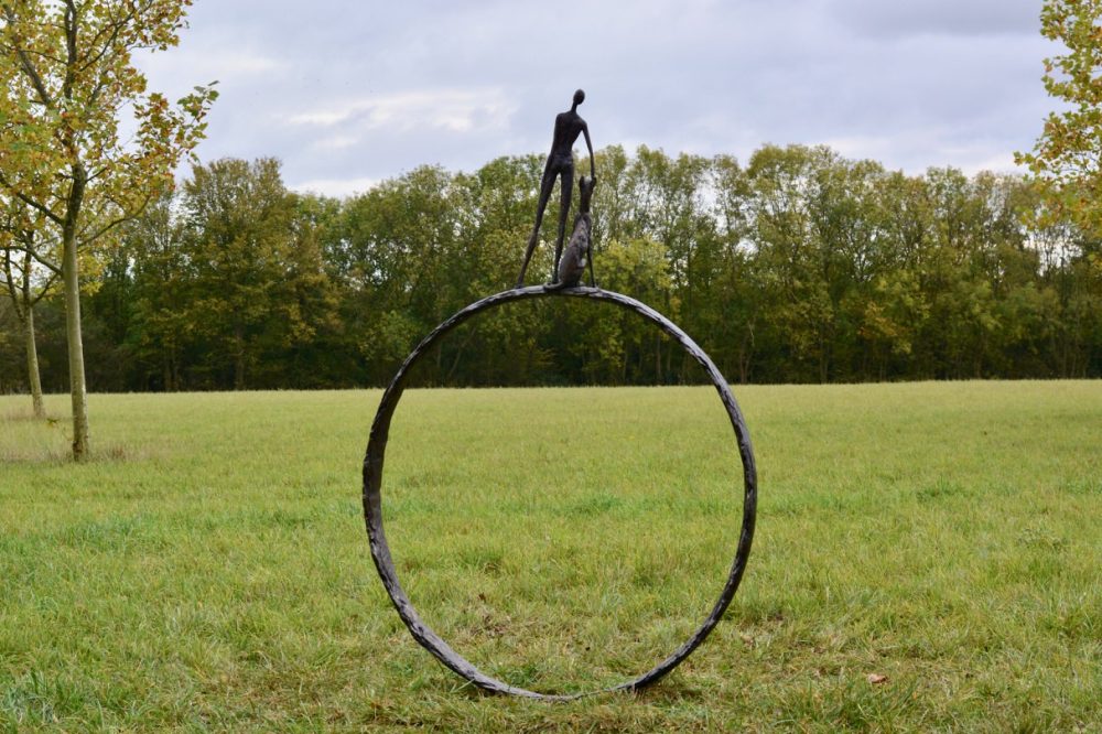 Man and Dog Ring Statue Outdoor