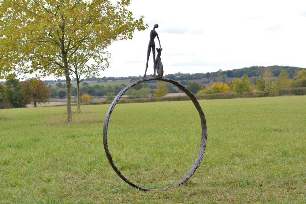 Man and Dog Ring Statue Garden