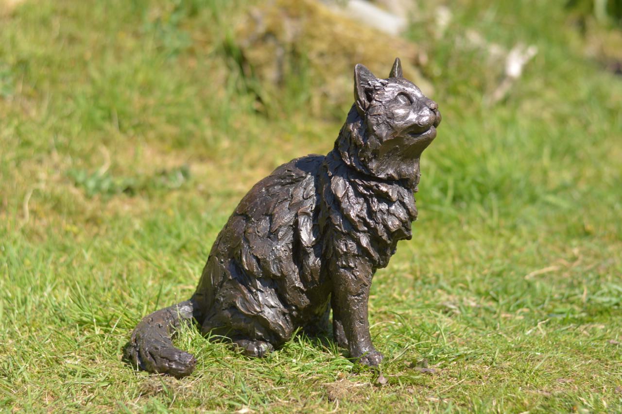 sitting longhaired cat sculpture