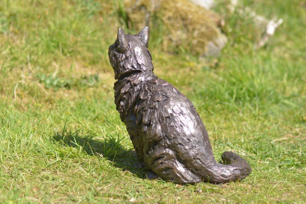 bronze sitting longhaired cat statue