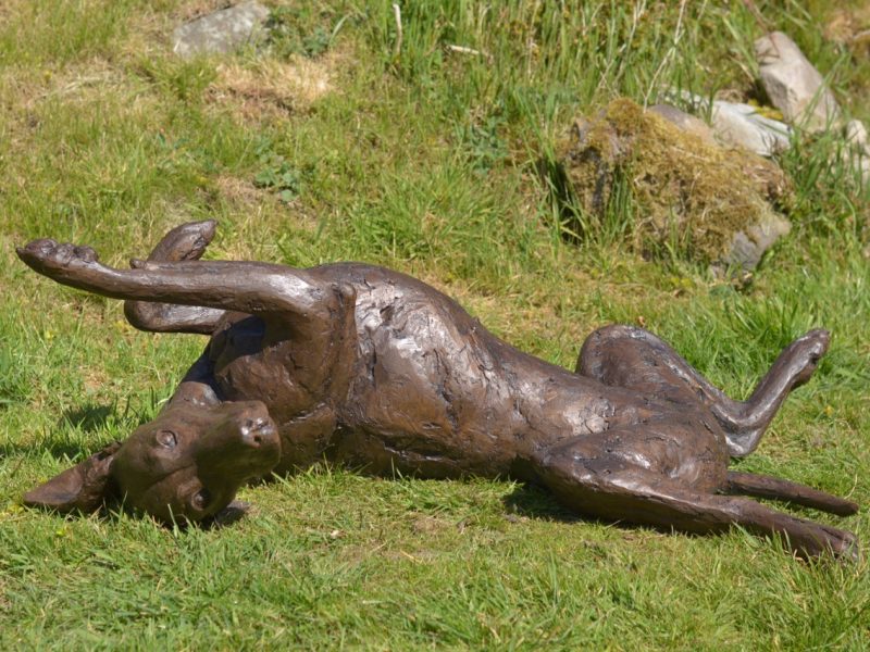 vizsla lying on its back bronze statue