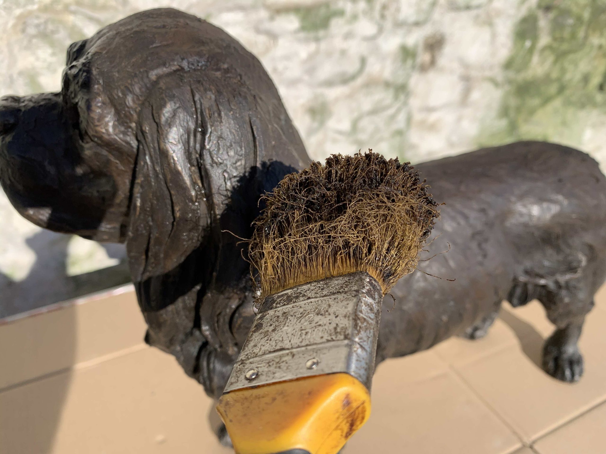 waxing an outdoor bronze sculpture