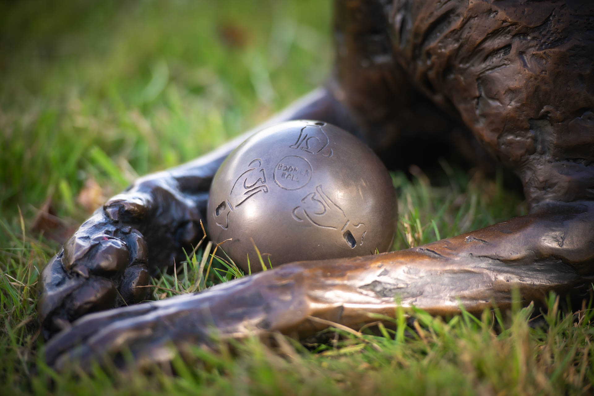 bronze sitting longhaired cat sculpture