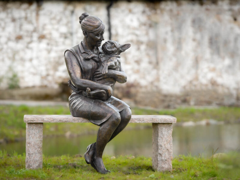 SITTING GIRL HOLDING FRENCH BULLDOG SCULPTURE