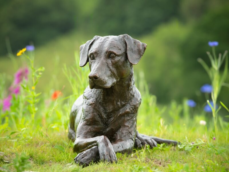 LYING MIXED BREED DOG SCULPTURE