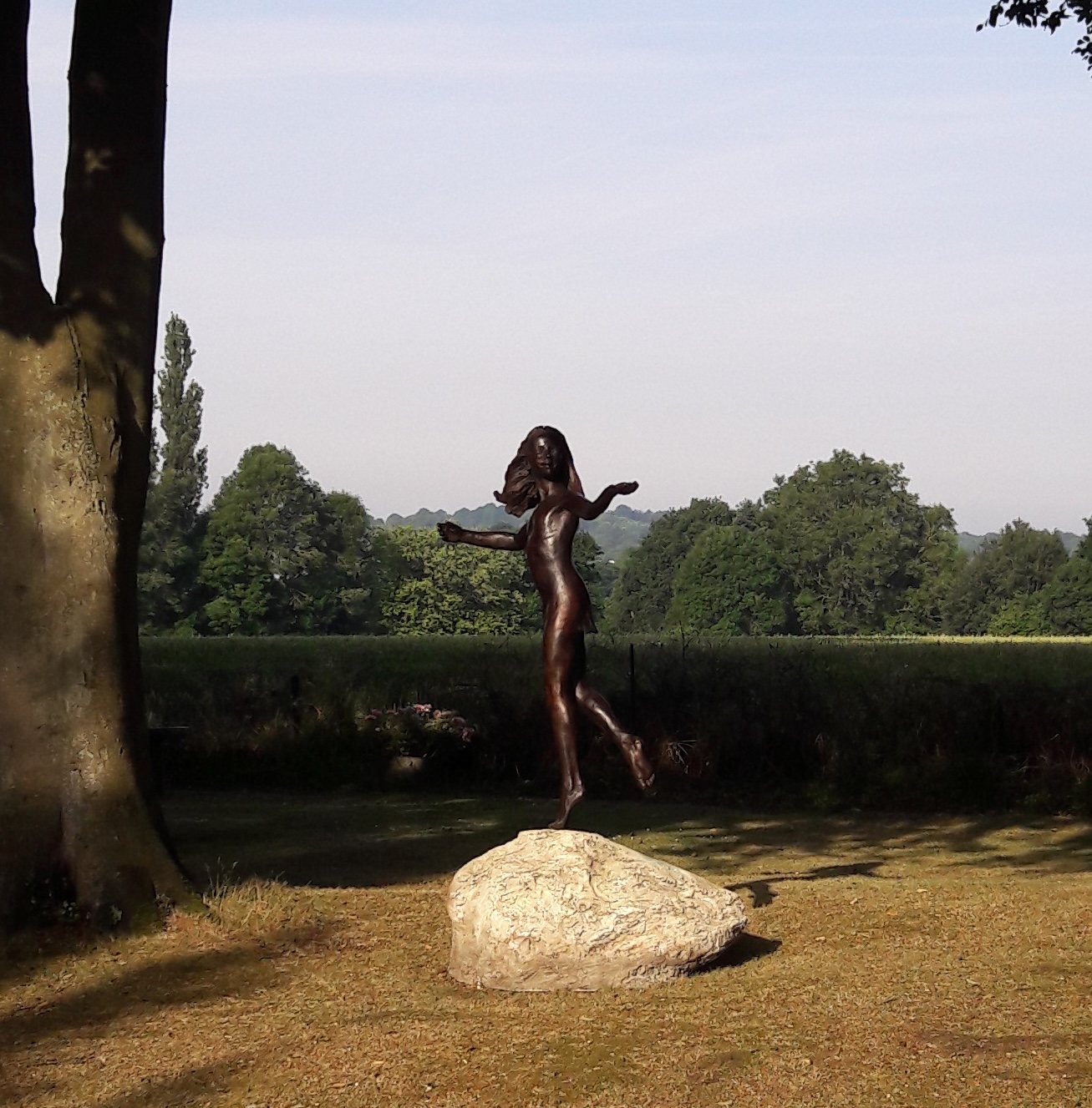 'Stargazers' man and dog on ring sculpture
