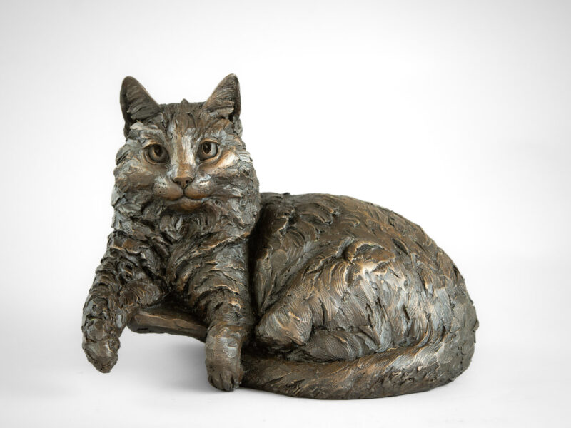 CAT LYING IN BASKET SCULPTURE
